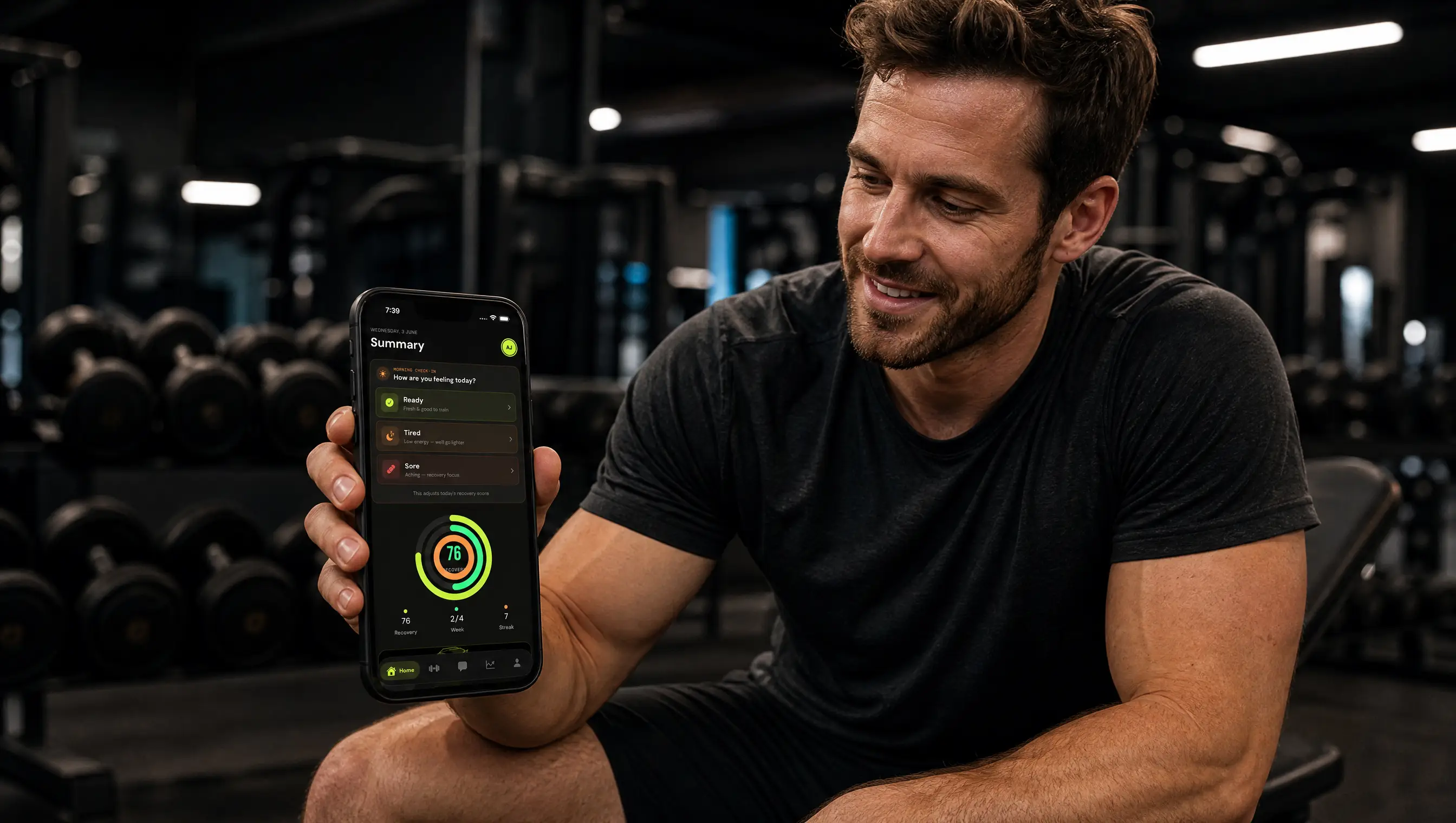 Athlete checking his daily recovery score on FitAI Coach in a dark gym